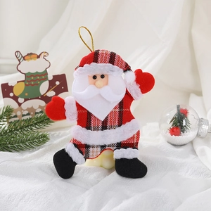 Detail of red and black plaid Santa Claus fabric ornament with gold hanging string