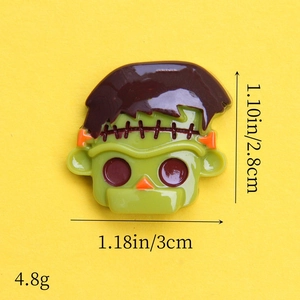 Green resin Frankenstein skull charm showing precise dimensions 1.18in x 1.10in