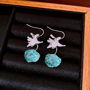 Elegant floral resin geometric earrings featuring silver lilies and blue stones in a gift box