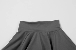 Detail view of high-waist charcoal grey trousers showing premium knit fabric texture
