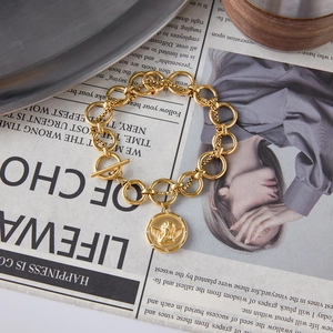 Vintage gold coin bracelet with angel relief and OT buckle in polished stainless steel
