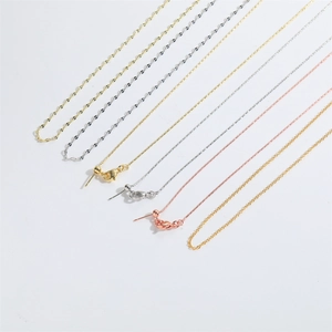 Set of gold, silver, and rose gold versatile metal chain necklaces on white background