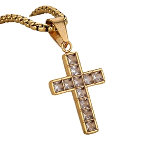 Hip hop style gold cross pendant necklace with sparkling square diamonds on a gold chain