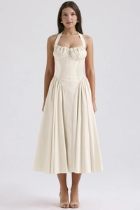 Elegant cream white halter neck midi dress with a cinched waist and pleated flared skirt