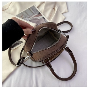 Detail view of the plush brown tote with herringbone lining and sturdy metal zipper