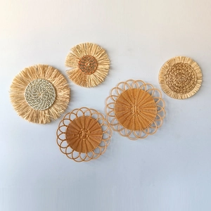 Set of 5 Bohemian woven grass wall decor plates in natural straw and raffia finish