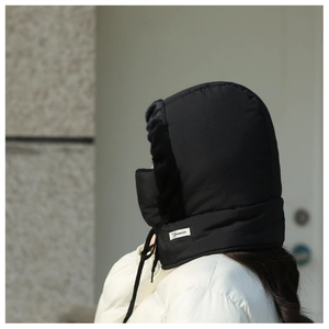 Close-up of windproof winter trapper hat with integrated mask and warm faux fur lining