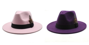 Detail of wool fedora hats with contrast grosgrain ribbon and feather accent