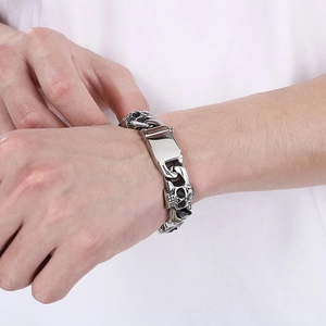 Men's punk skull Cuban chain bracelet in silver-plated stainless steel on a wrist