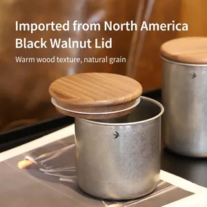 Stainless steel airtight food storage jar with walnut lid and engraved swallow pattern