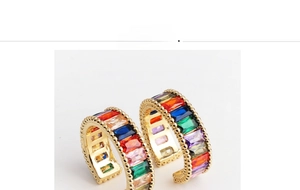 Detailed close-up of rainbow baguette zircon ring with delicate beaded gold edges