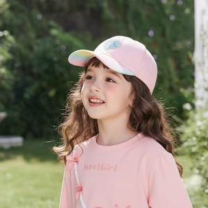 Close-up of pink girl's baseball cap with silver sequin heart and rainbow gradient brim