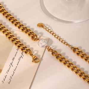 Golden stainless steel Cuban chain necklace featuring a white pearl pendant and toggle clasp