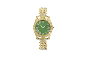 Detailed close-up of a luxury gold quartz watch with a green dial and crystal bezel