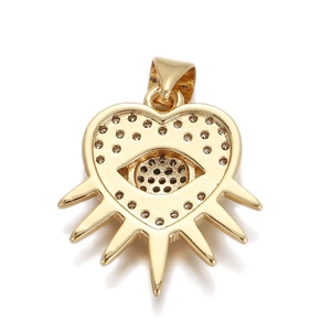 Macro shot of gold-plated evil eye heart pendant with sunburst spikes for DIY jewelry