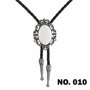 Macro detail of antique silver crown bolo tie slide with white stone and woven cord