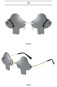 Mushroom shaped sunglasses with smoke lenses and gold metal frame shown in two angles