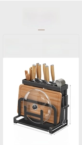 Detailed view of the black carbon steel kitchen organizer for knives and boards