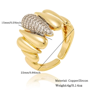 Macro detail of adjustable gold plated copper ring with teardrop micro-pave zircon settings