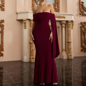 Close-up of elegant burgundy off-shoulder evening gown with floor-length fishtail hem