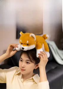 Detail showing the ultra-soft golden plush fur texture of the Shiba Inu plush toy
