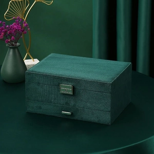 Three-layer vintage dark green velvet jewelry box with metal lock and top handle