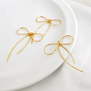 Handcrafted 14K gold filled bow charms with spiral texture for DIY jewelry making