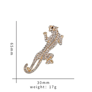 Detailed view of leopard brooch with clear rhinestones measuring 65mm x 30mm