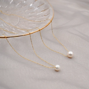 French retro minimalist gold chain necklace with single white round pearl pendant