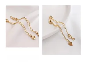 Close-up of 14K gold plated necklace extender chain with lobster clasp and heart tag