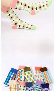 Close-up of colorful checkered mid-calf socks featuring geometric patterns and cotton blend