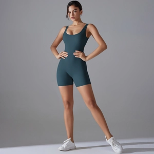 Detail of teal V-shaped back yoga romper showing high-stretch fabric and slim fit design