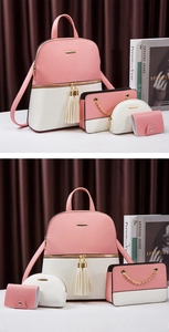 Detail of pink and white 4-piece backpack set featuring crossgrain PU leather and tassels