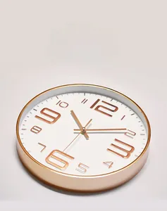 Detail view of 10-inch quartz wall clock with rose gold frame and 3D numerals