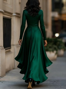 Elegant dark green satin long dress with ruffle hem and back view on city street