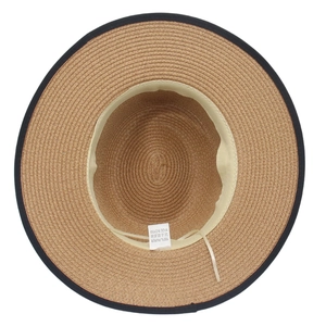 Detail view of woven paper straw hat interior showing the sweatband and 100% paper care label