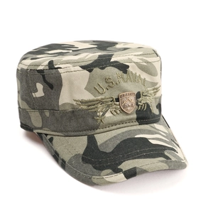 Detail of army camouflage military hat with U.S. NAVAL embroidery and metal shield badge