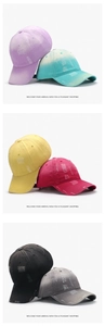 Detail view of washed cotton baseball caps showing distressed ripped fabric and six colors