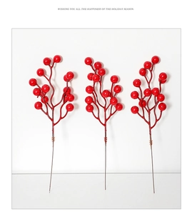 Detailed view of three artificial red berry branches for Christmas tree floral decoration
