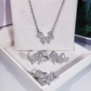 Sparkling silver bow jewelry set with necklace, earrings and ring in a gift box