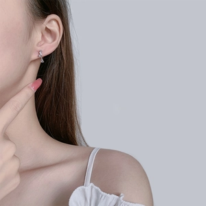 Elegant S925 silver flower earrings with sparkling crystals and teardrop pendant on model