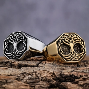 Octagonal Tree of Life relief rings in gold and silver stainless steel on wood bark