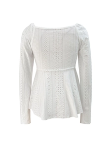Detailed view of white long sleeve eyelet lace top with square neck and peplum hem