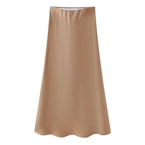 Detail showing smooth champagne satin fabric and high-waisted A-line midi skirt cut