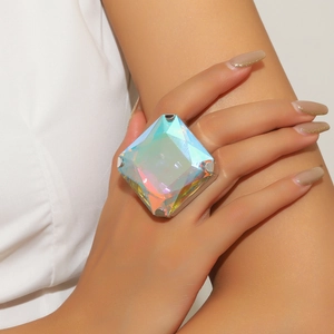 Close-up of a large square AB crystal ring on model's finger with iridescent reflections