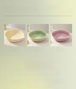 Close-up of cream ceramic soup bowl featuring 3D petal texture and dual handles