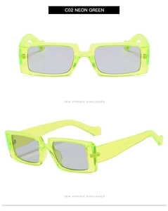 Detail view of neon green rectangular sunglasses with transparent frames and grey lenses