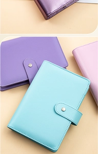 Detail of macaron PU leather loose-leaf notebook binders with textured finish and snap closure