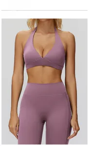 Detail of medium grey purple halter neck sports bra and high waist yoga leggings set