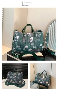 Detail of green quilted tote bag with white skull print and purple floral patterns
